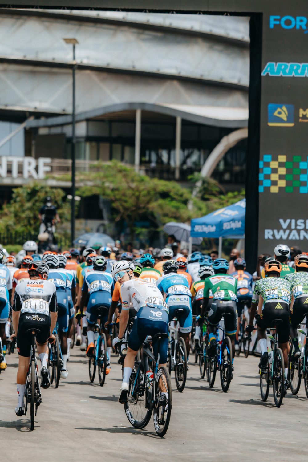 Cyclists competing in the Tour du Rwanda near the Kigali Convention Centre, showcasing Rwanda’s cycling culture ahead of hosting the UCI Road World Championships 2025, the first edition in Africa.